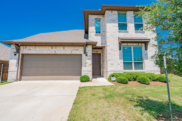 1302 Canyon Creek Rd, Wylie, TX 75098 - view of front of house with brick siding, a garage, driveway, and a front yard