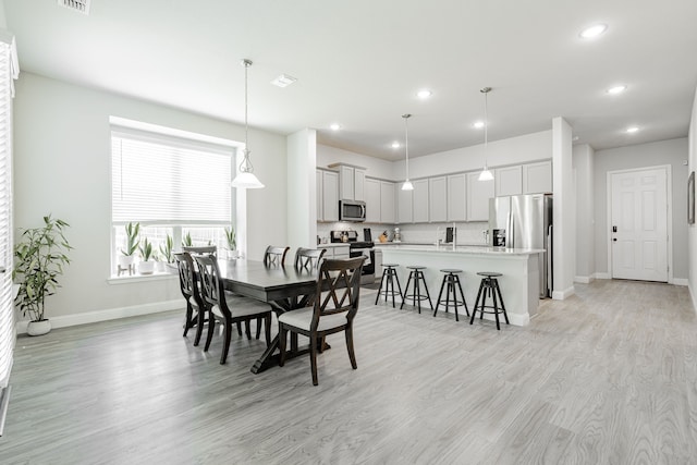 1302 Canyon Creek Rd, Wylie, TX 75098 - dining room with baseboards, light wood-type flooring, and recessed lighting