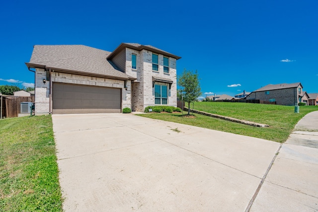 1302 Canyon Creek Rd, Wylie, TX 75098 - view of front of property featuring concrete driveway, an attached garage, brick siding, cooling unit, and a shingled roof
