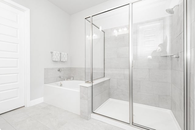 1302 Canyon Creek Rd, Wylie, TX 75098 - bathroom with a bath, a shower stall, baseboards, and tile patterned flooring