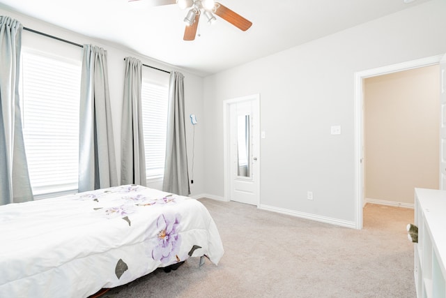 1302 Canyon Creek Rd, Wylie, TX 75098 - bedroom with light colored carpet, baseboards, and a ceiling fan
