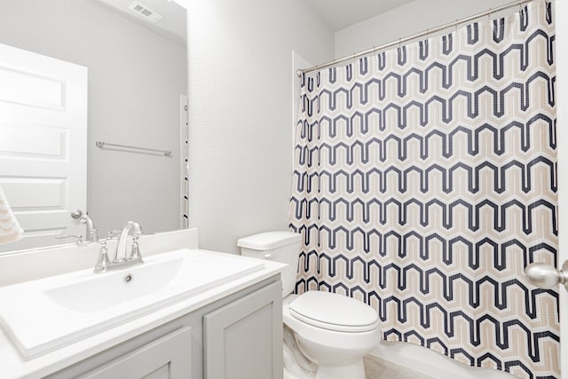 1302 Canyon Creek Rd, Wylie, TX 75098 - bathroom with toilet, vanity, and curtained shower