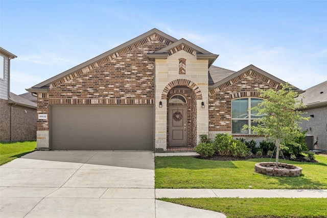 15532 Balham Pass, Fort Worth, TX 76247 - french country home with brick siding, a front lawn, concrete driveway, a garage, and stone siding