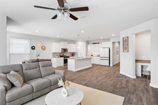 15532 Balham Pass, Fort Worth, TX 76247 - living area with wood finished floors, a ceiling fan, recessed lighting, and baseboards
