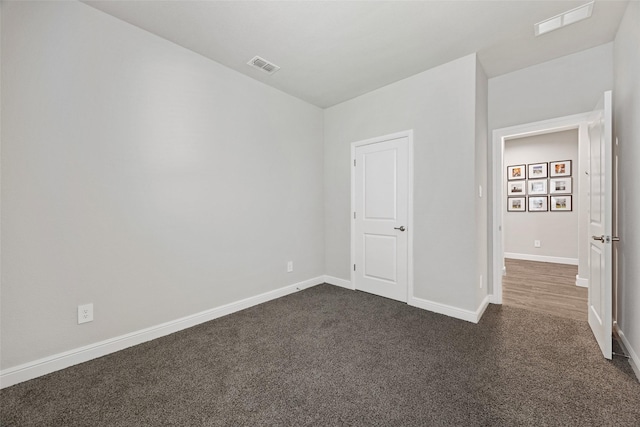 15532 Balham Pass, Fort Worth, TX 76247 - unfurnished bedroom with dark carpet and baseboards