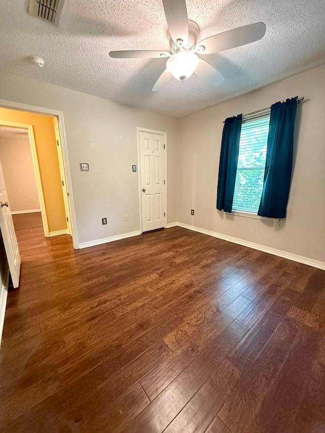 11535 Timber Ridge Dr, Keithville, LA 71047 - unfurnished room with ceiling fan, a textured ceiling, wood finished floors, and baseboards