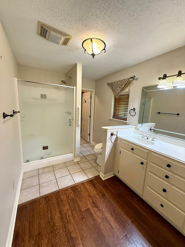 11535 Timber Ridge Dr, Keithville, LA 71047 - full bathroom with toilet, vanity, a stall shower, wood finished floors, and baseboards
