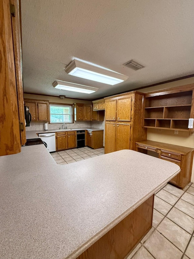 11535 Timber Ridge Dr, Keithville, LA 71047 - kitchen featuring dishwasher, a sink, brown cabinets, open shelves, and a textured ceiling