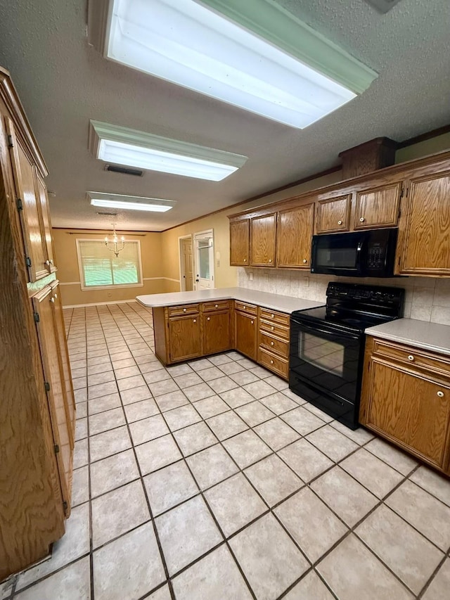 11535 Timber Ridge Dr, Keithville, LA 71047 - kitchen featuring black appliances, a peninsula, light tile patterned floors, brown cabinetry, and light countertops