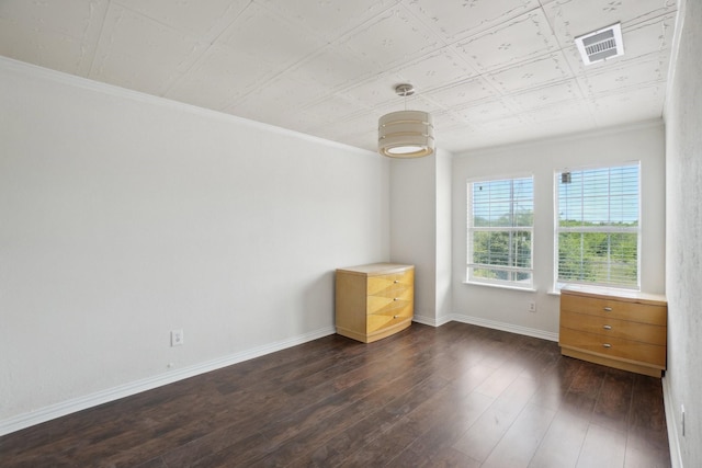 12848 Hilltop Dr, Balch Springs, TX 75180 - unfurnished bedroom featuring dark wood finished floors, ornamental molding, and baseboards