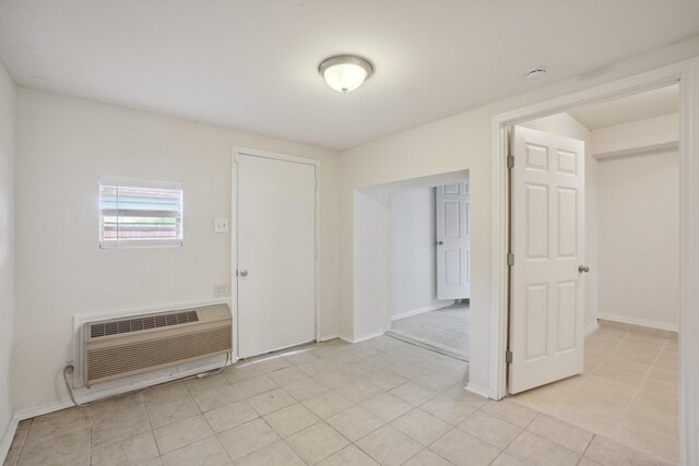12848 Hilltop Dr, Balch Springs, TX 75180 - spare room with a wall unit AC and baseboards
