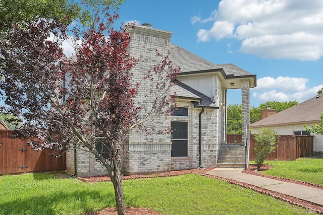 12848 Hilltop Dr, Balch Springs, TX 75180 - rear view of property with a chimney, roof with shingles, and stone siding