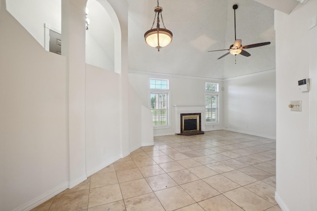 12848 Hilltop Dr, Balch Springs, TX 75180 - unfurnished living room featuring high vaulted ceiling, ceiling fan, light tile patterned floors, arched walkways, and baseboards