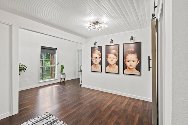 313 Chicken St, Weston, TX 75009 - empty room featuring dark wood finished floors, a chandelier, and baseboards