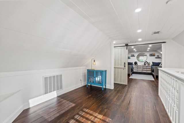 313 Chicken St, Weston, TX 75009 - additional living space with dark wood-type flooring, a barn door, lofted ceiling, recessed lighting, and baseboards
