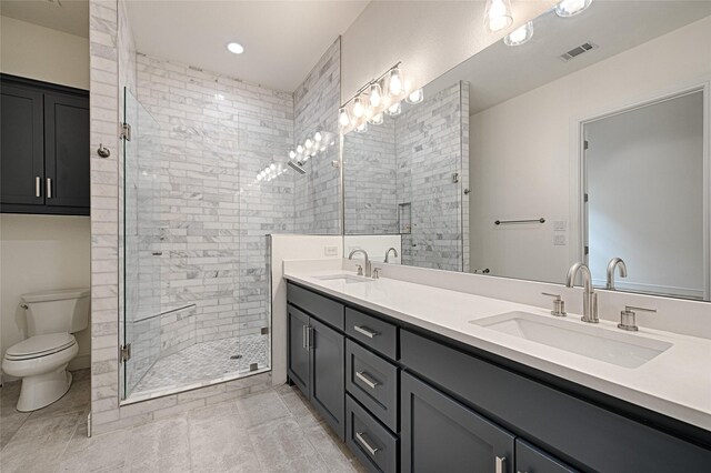 5067 Gaston Ave, Dallas, TX 75214 - bathroom with double vanity, toilet, a stall shower, and recessed lighting
