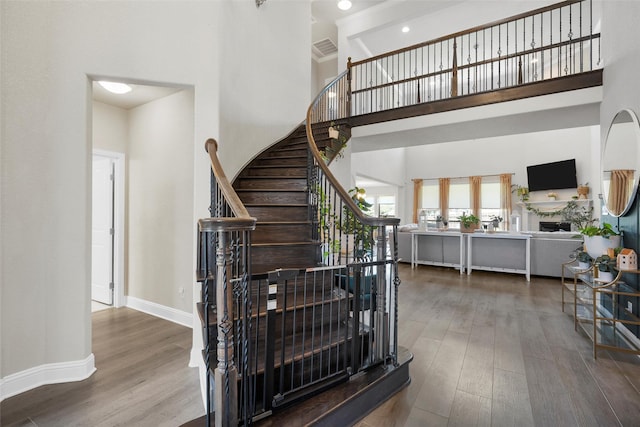 205 Big Creek Loop, Hewitt, TX 76643 - stairway with a high ceiling, wood finished floors, and baseboards