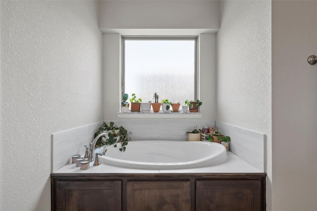 205 Big Creek Loop, Hewitt, TX 76643 - bathroom with a textured wall and a garden tub