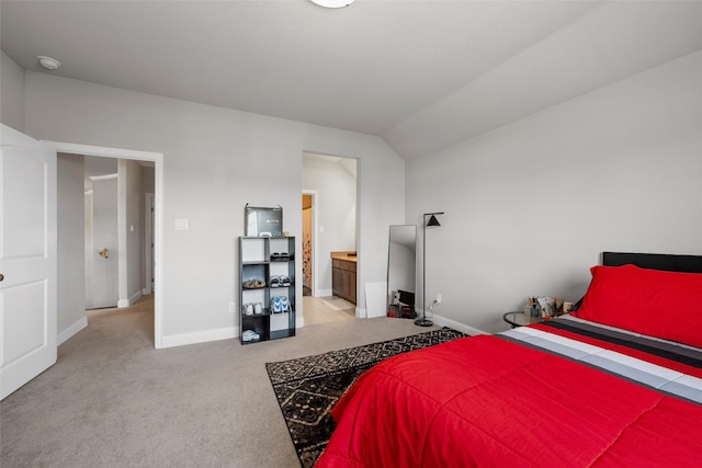 205 Big Creek Loop, Hewitt, TX 76643 - bedroom featuring light colored carpet, baseboards, vaulted ceiling, and ensuite bath