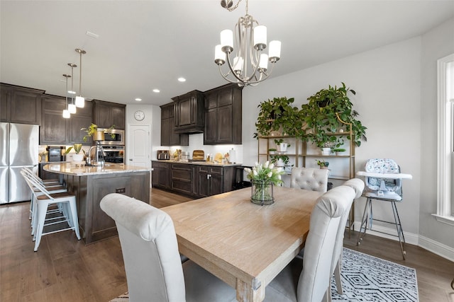 205 Big Creek Loop, Hewitt, TX 76643 - dining space with a chandelier, dark wood-style flooring, recessed lighting, and baseboards