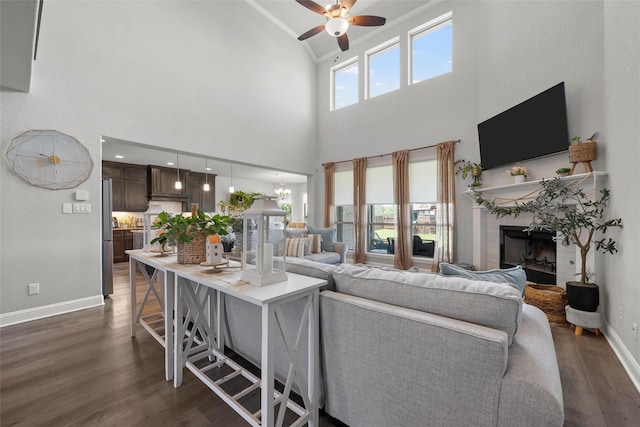205 Big Creek Loop, Hewitt, TX 76643 - living room with a ceiling fan, dark wood-style floors, baseboards, a fireplace, and high vaulted ceiling