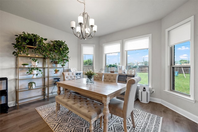 205 Big Creek Loop, Hewitt, TX 76643 - dining area with a chandelier, healthy amount of natural light, dark wood-style floors, and baseboards