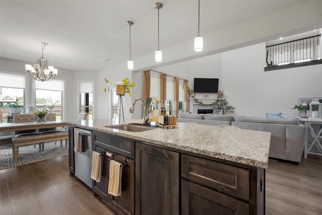 205 Big Creek Loop, Hewitt, TX 76643 - kitchen featuring a sink, open floor plan, dishwasher, and dark wood finished floors