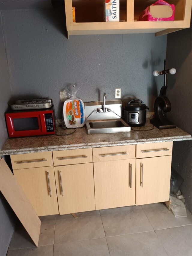 2911 S Denley Dr, Dallas, TX 75216 - kitchen with a sink, light tile patterned floors, and white microwave
