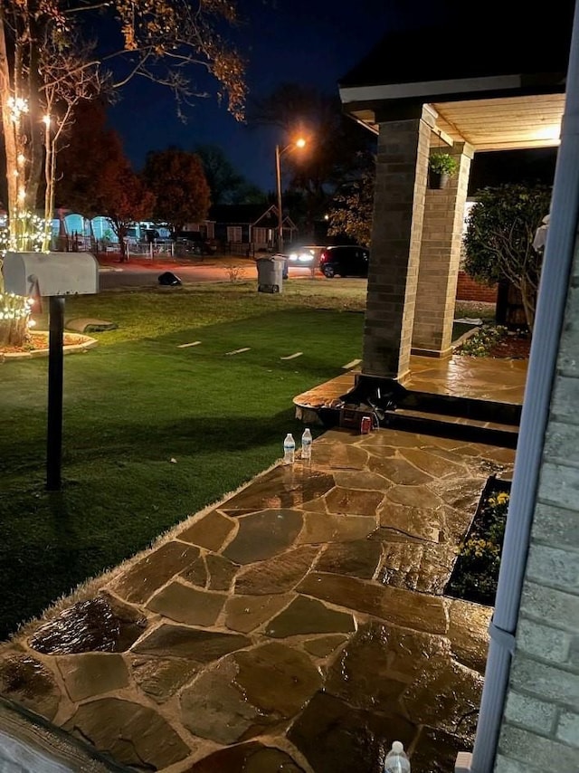 2911 S Denley Dr, Dallas, TX 75216 - patio at twilight featuring a yard