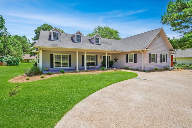 622 Green Meadow Trl, Holly Lake Ranch, TX 75765 - view of front of house featuring covered porch, a front lawn, and a shingled roof
