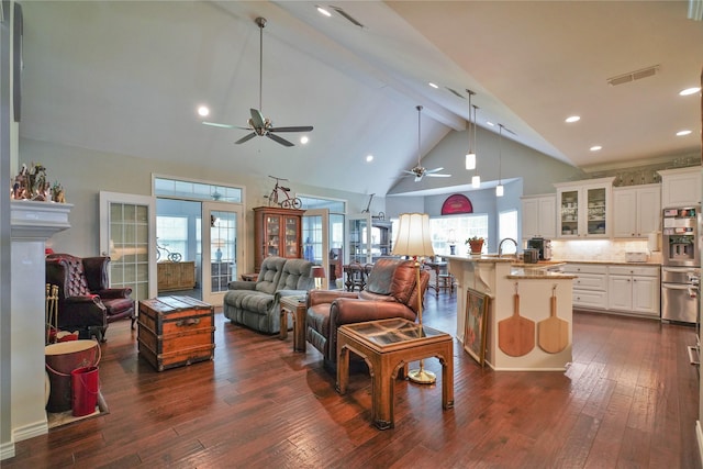 622 Green Meadow Trl, Holly Lake Ranch, TX 75765 - living room with a ceiling fan, high vaulted ceiling, beam ceiling, dark wood finished floors, and plenty of natural light