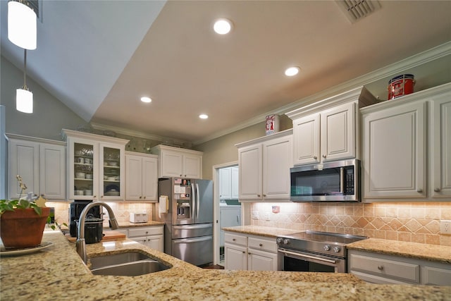 622 Green Meadow Trl, Holly Lake Ranch, TX 75765 - kitchen with stainless steel appliances, ornamental molding, a sink, light stone countertops, and white cabinets