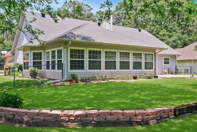 622 Green Meadow Trl, Holly Lake Ranch, TX 75765 - rear view of house with a shingled roof and a chimney