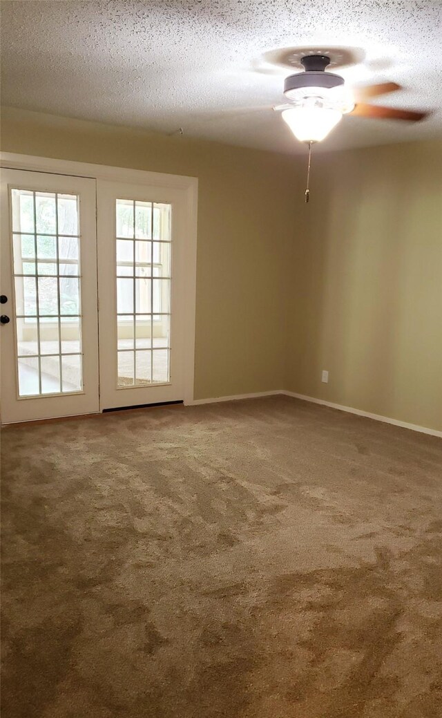 401 S Timberlane, Lone Star, TX 75638 - spare room with ceiling fan, carpet flooring, a textured ceiling, and baseboards