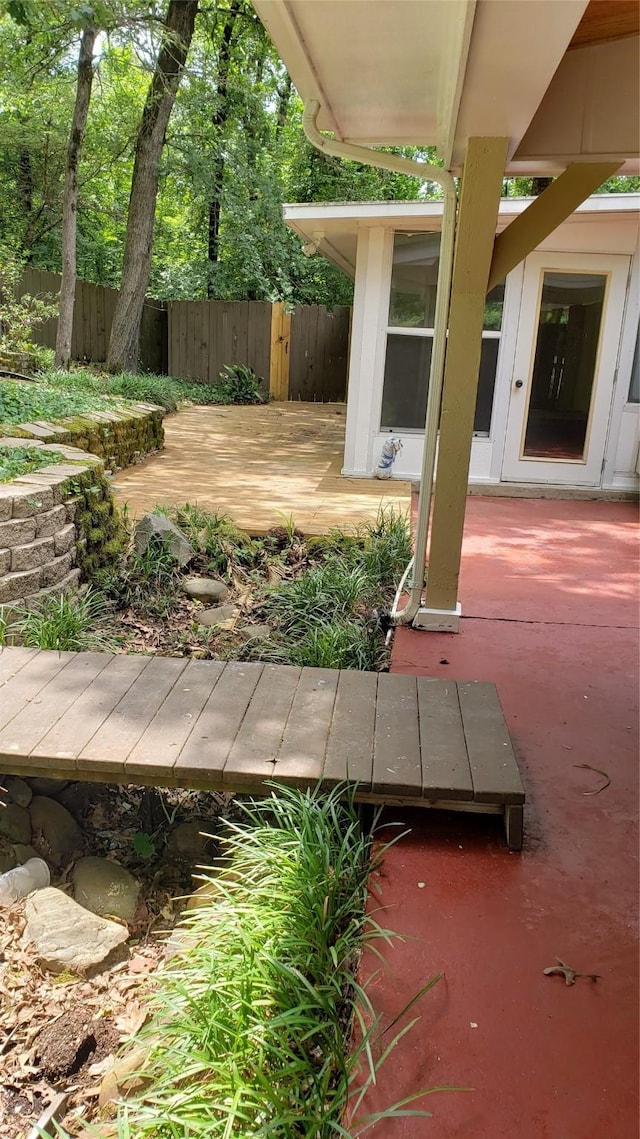 401 S Timberlane, Lone Star, TX 75638 - wooden deck with a patio area