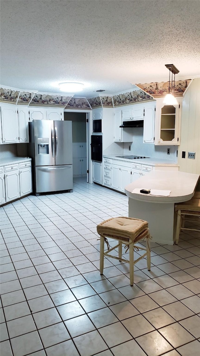 401 S Timberlane, Lone Star, TX 75638 - kitchen with stainless steel refrigerator with ice dispenser, black electric stovetop, white cabinetry, a peninsula, and a textured ceiling