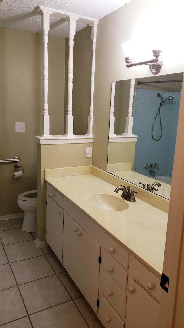 401 S Timberlane, Lone Star, TX 75638 - full bath with toilet, vanity, tile patterned flooring, a textured ceiling, and tub / shower combination