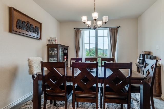 5725 Miriam Dr, Forney, TX 75126 - dining room with a chandelier, baseboards, and wood finished floors