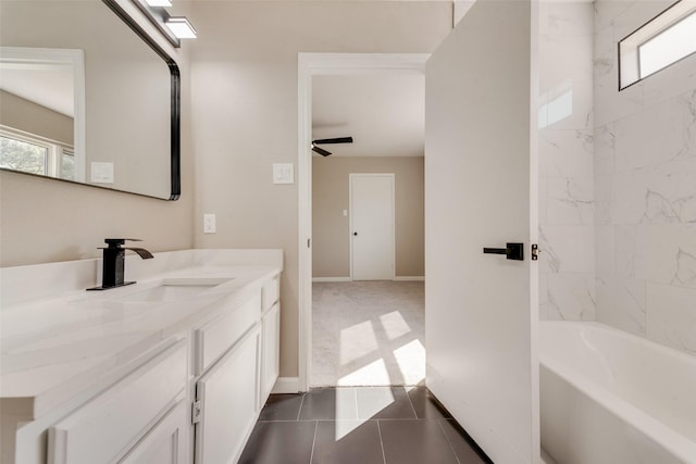 2209 Country Oaks Dr, Garland, TX 75040 - full bathroom featuring vanity, healthy amount of natural light, baseboards, and shower / bath combination