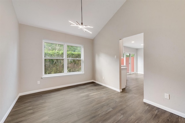 2209 Country Oaks Dr, Garland, TX 75040 - empty room with a chandelier, dark wood-style flooring, baseboards, and high vaulted ceiling