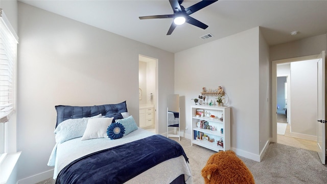 126 Saint Andrews Dr E, Mabank, TX 75156 - bedroom with light carpet, ensuite bathroom, a ceiling fan, and baseboards