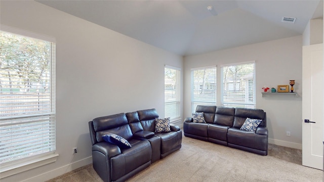 126 Saint Andrews Dr E, Mabank, TX 75156 - living room featuring healthy amount of natural light, light carpet, lofted ceiling, and baseboards
