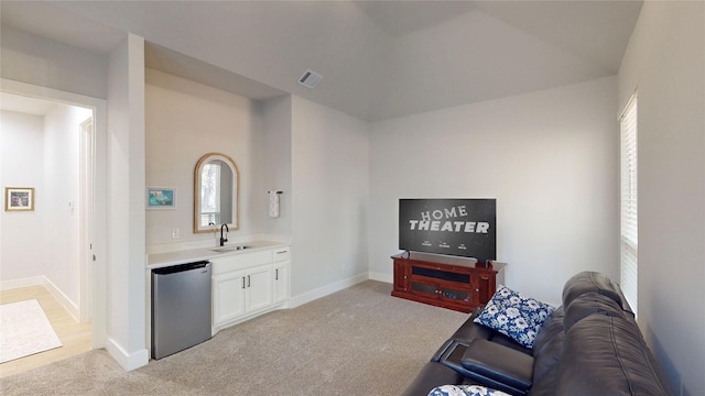 126 Saint Andrews Dr E, Mabank, TX 75156 - living area featuring light colored carpet, plenty of natural light, and baseboards