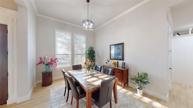 126 Saint Andrews Dr E, Mabank, TX 75156 - dining area with light wood-style floors, ornamental molding, a chandelier, and baseboards