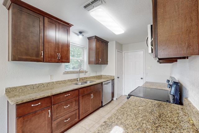 6432 Melinda Ct, Watauga, TX 76148 - kitchen featuring stainless steel appliances, a sink, light tile patterned floors, a textured ceiling, and dark brown cabinets