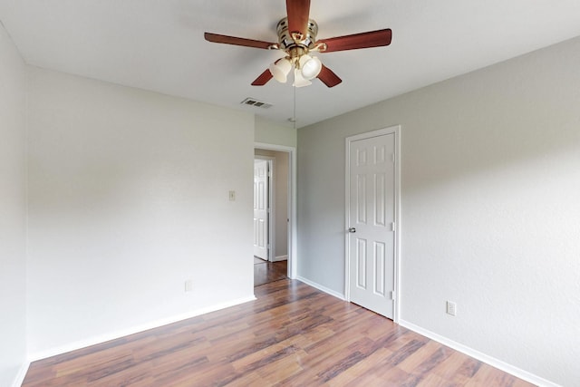 6432 Melinda Ct, Watauga, TX 76148 - spare room with a ceiling fan, wood finished floors, and baseboards