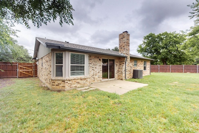 6432 Melinda Ct, Watauga, TX 76148 - rear view of house featuring a chimney, central air condition unit, a patio area, and brick siding