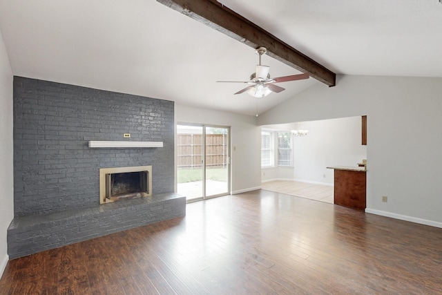 6432 Melinda Ct, Watauga, TX 76148 - unfurnished living room with ceiling fan, a brick fireplace, a chandelier, wood finished floors, and baseboards