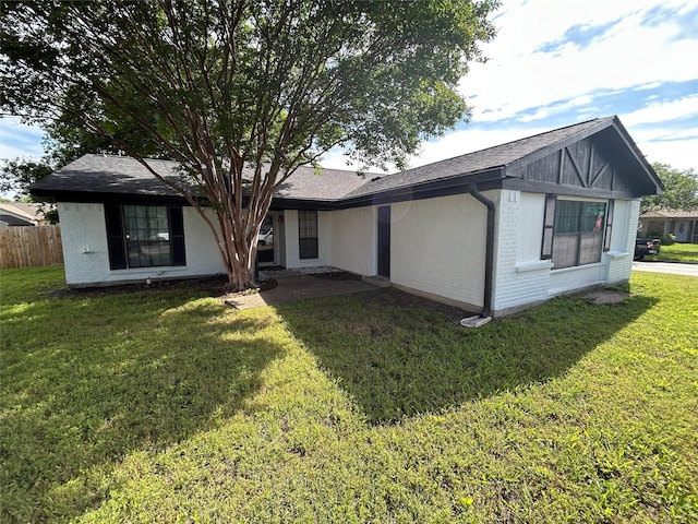3913 Longstraw Dr, Fort Worth, TX 76137 - back of house with brick siding and a shingled roof