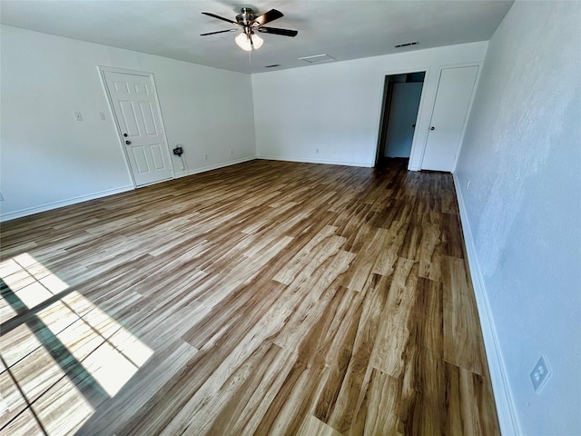3913 Longstraw Dr, Fort Worth, TX 76137 - unfurnished room with wood finished floors, a ceiling fan, and baseboards